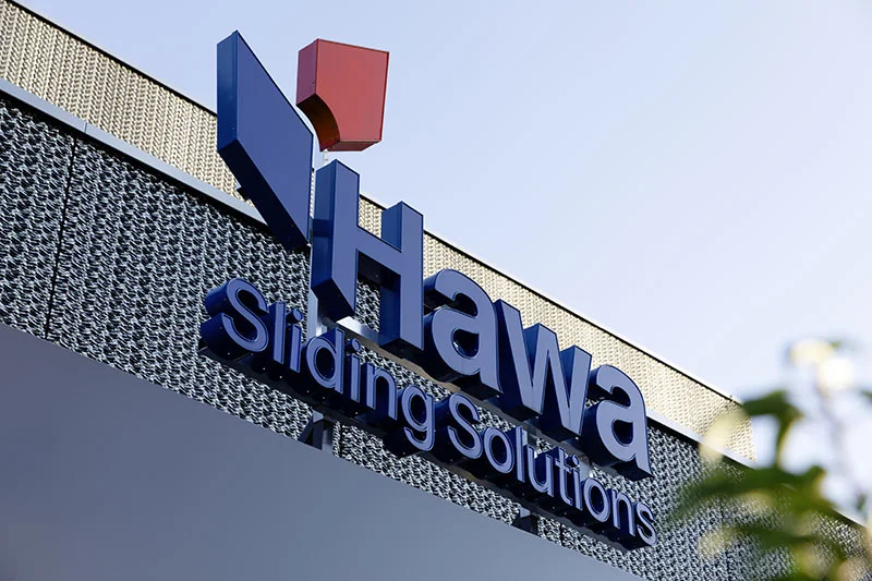 Sign on building reads Hawa Sliding Solutions
